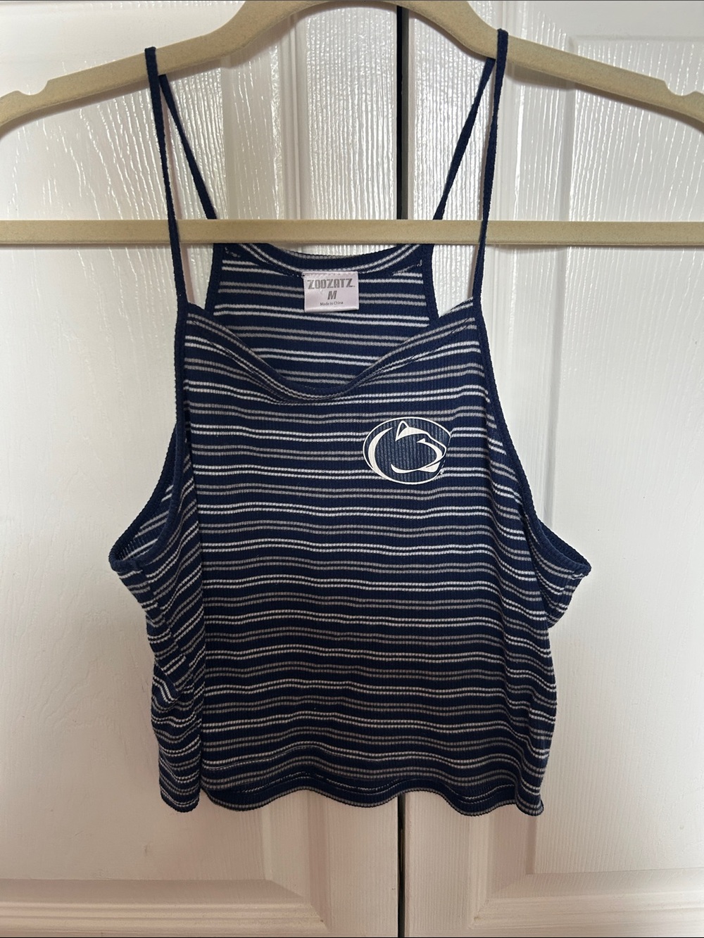 Navy blue and white striped crop tank top with Penn State logo